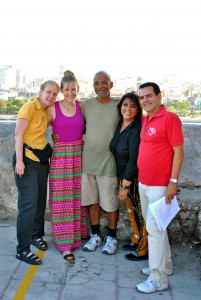 group of people smile with arms around each other